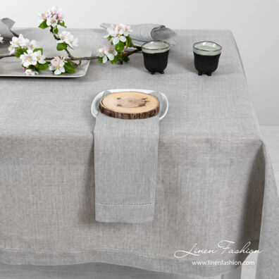 Light grey pure linen tablecloth in a small openwork pattern