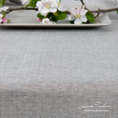 Light grey patterned linen tablecloth with hemstitch
