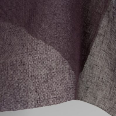 Transparent linen fabric in dark violet colour close up detail