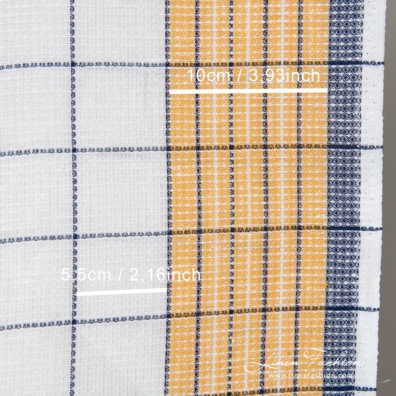 Optical white, pale orange and dark blue checked linen / cotton "waffle" fabric is ideal for sewing kitchen towels