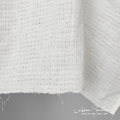 Light grey washed openwork linen fabric is perfect to sew the summer clothes and shawls