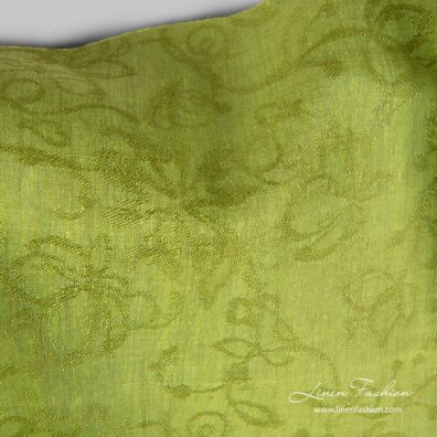 Linen fabric with woven flowers, green melange color