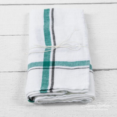 White linen kitchen towel with green/black checks