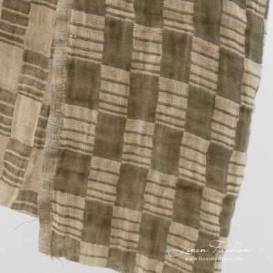 Washed linen fabric in green and yellowish colour.