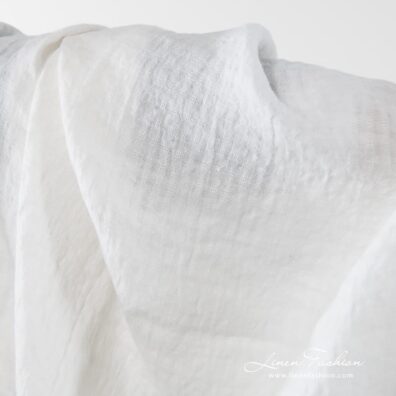 Washed 100% linen fabric in off white.