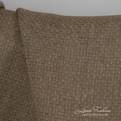 Brown dyed linen fabric with spots.