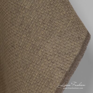 100% linen fabric in brown colour with spots.