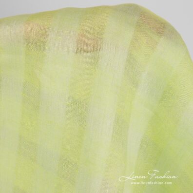 Checked linen fabric in light lime green colour.