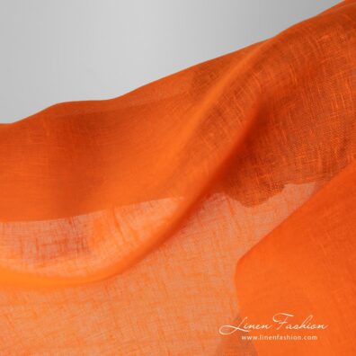 Gauze linen fabric in bright orange color.