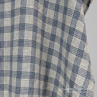 Washed cream colour linen fabric in checks.