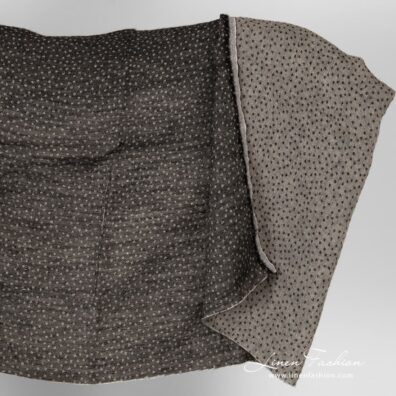 Linen wool black dotted fabric, washed.