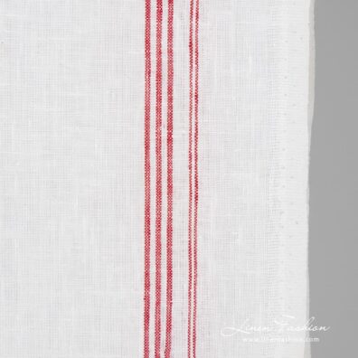 White linen fabric in crimson stripes