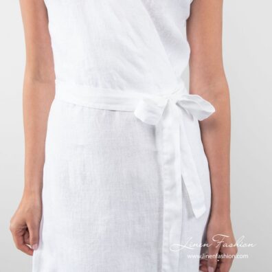 White linen dress tied with a strap