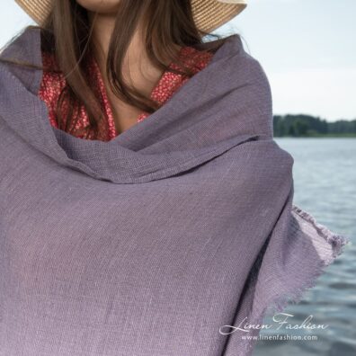 Beach towel woven in several shades of violet yarns