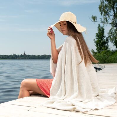 Linen light grey beach towel with loose fringes on the short sides