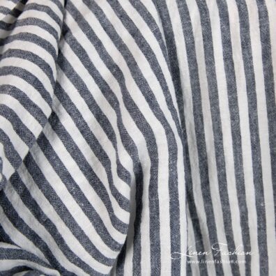 Wide linen fabric in blue stripes, specially washed to increase softness