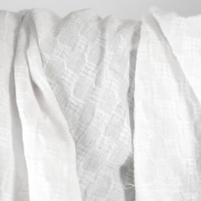 Optical white linen fabric in checks, specially washed to increase softness