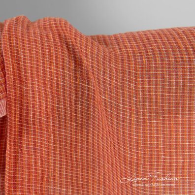 Transparent linen fabric in orange melange, specially washed
