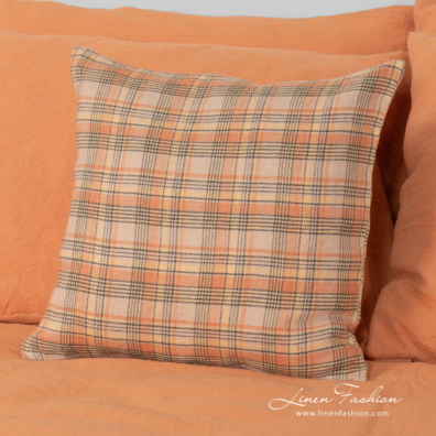 linen cotton orange bedlinen with small decorative pillow case.