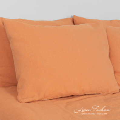 linen cotton orange bedlinen with different pillow case sizes.