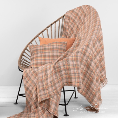 checked linen throw with cushions.