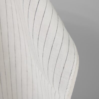 Linen fabric off-white colour with black stripes close up detail pinstripes