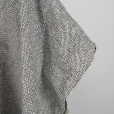 Linen fabric washed dark grey colour close up edge view