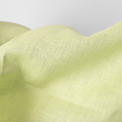 Linen fabric light greenish yellow colour close up detail photo