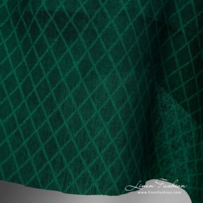 Linen fabric green colour rhombus pattern close up edge view