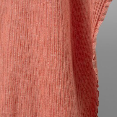 Washed linen cotton fabric in red-white stripes edge view
