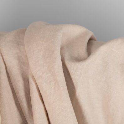 Washed linen cotton fabric light brown colour close up view