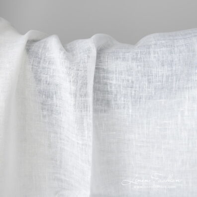 Lightweight linen fabric bright white colour close up detail