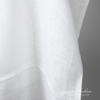 Lightweight linen fabric bright white colour edge view