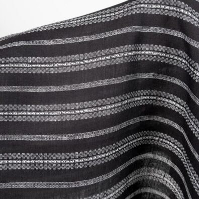 Linen fabric black with white patterned stripes close up detail