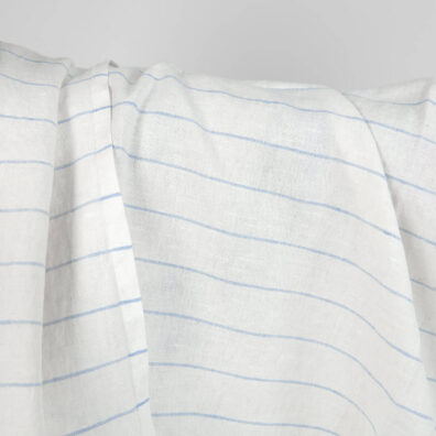 Washed linen cotton fabric white with sky blue stripes close up detail