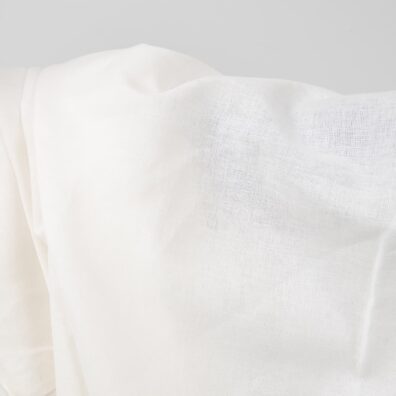 Wide linen cotton fabric white colour close up photo