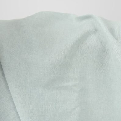 Wide linen cotton fabric pale turquoise colour close up view