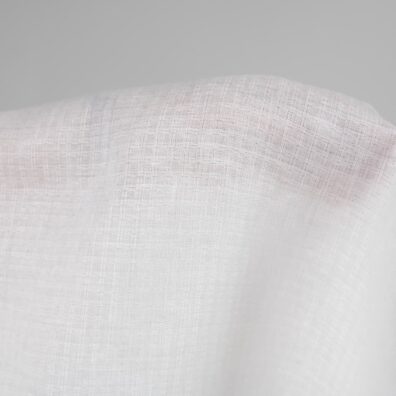 Linen fabric off-white colour patterned checks close up detail