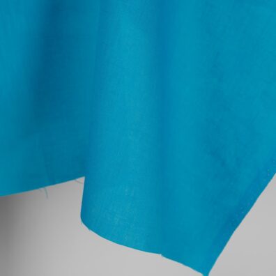 Linen fabric in vivid blue colour edge
