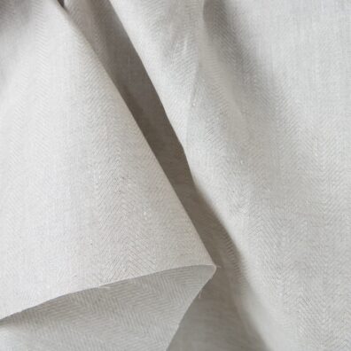 Linen fabric beige in herringbone pattern close up detail