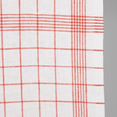 Narrow linen fabric bright white with red checks close up detail