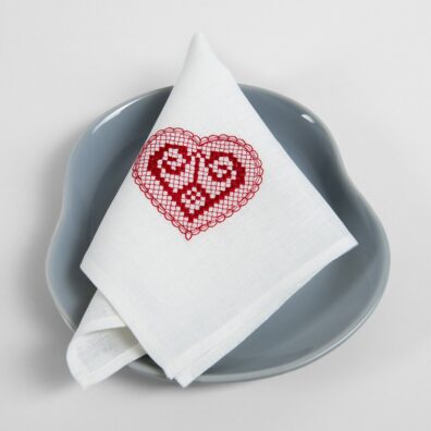 White linen napkin with red embroidery