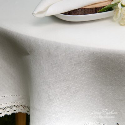 NORA linen round tablecloth, white colored.
