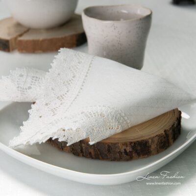 White colored linen napkin with hole pattern.