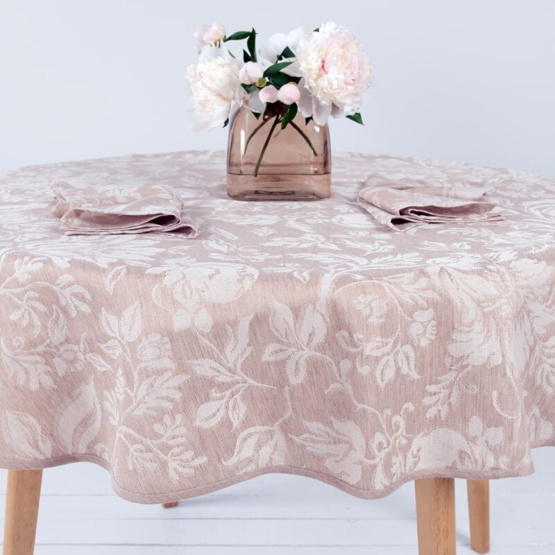 Round linen table cloth in floral pattern.