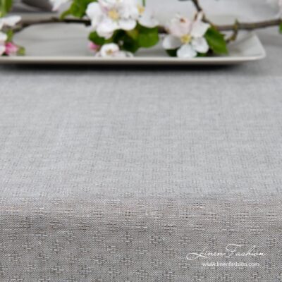 Light grey patterned linen tablecloth with hemstitch