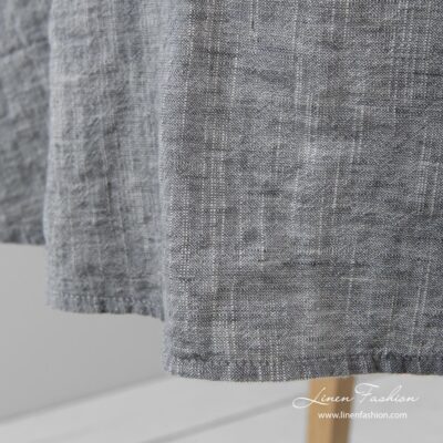 ASTRA Tablecloth round dark grey 9 Simple hemmed round tablecloth in dark grey and white melange colors