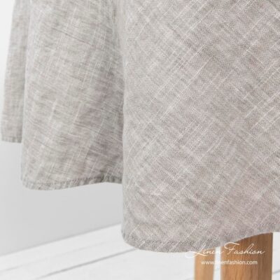 Light grey colored round tablecloth, astra.