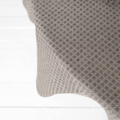 dark brown patterned linen-cotton tablecloth, close top view