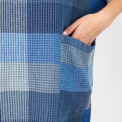 blue linen poncho with pockets.
